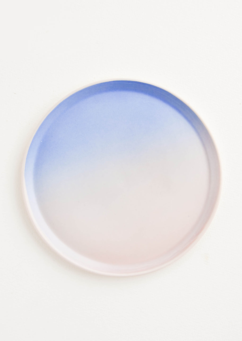 Dusk: A rimmed porcelain blue and pink ombre plate.