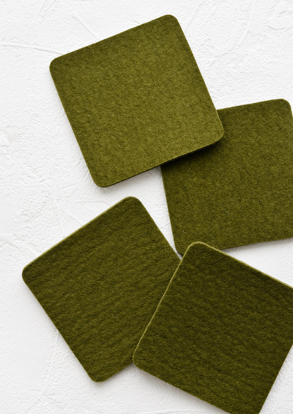 Army: A set of four square merino wool coasters in army green.