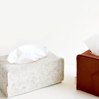 Oblong / Heather White: Tissue box covers in cube and rectangle shapes made from felted wool with natural leather accents