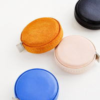 Klein Blue: Product shot featuring multiple styles of leather covered tape measures.