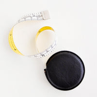 Black: Tape measure covered in black leather.