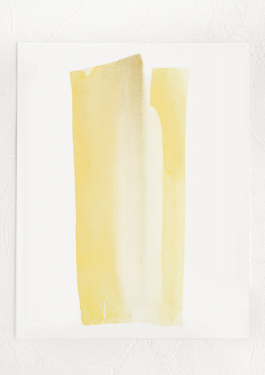 An art print with streak-like watercolor form in shades of yellow.