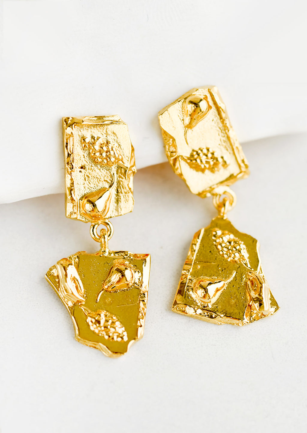 1: A pair of earrings with double broken tile silhouette.