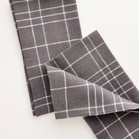 Charcoal Grid: Pair of fabric dinner napkins in grey and white grid pattern