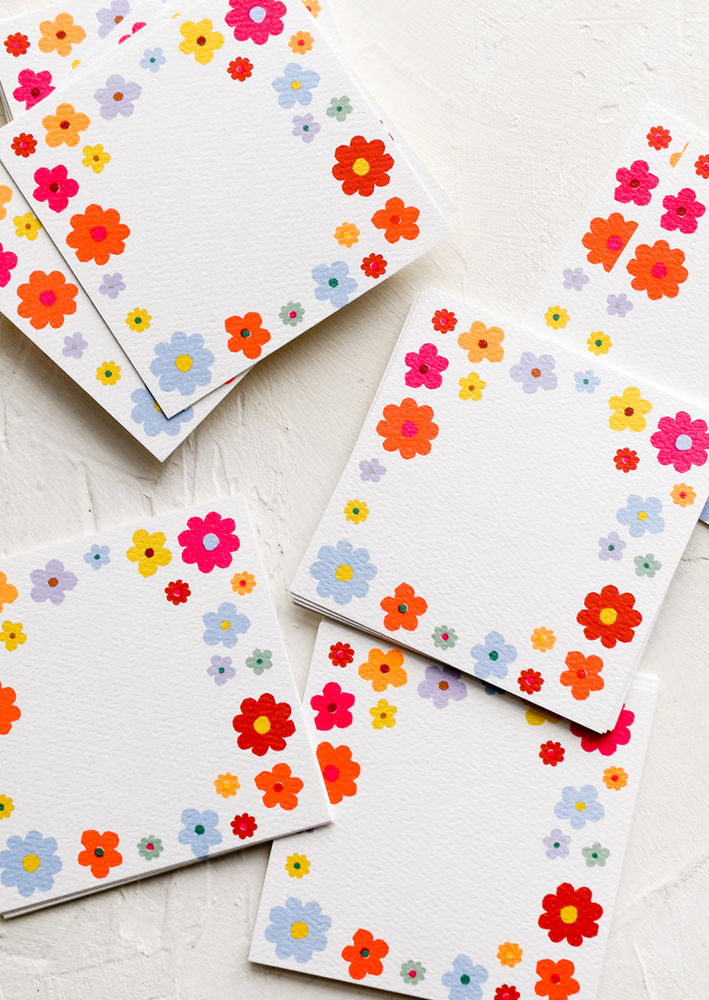 1: Mini square notecards with floral border.