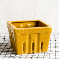 Dijon: A ceramic berry basket in dijon yellow.