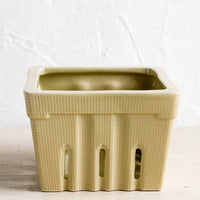 Greige: A ceramic berry basket in greige.