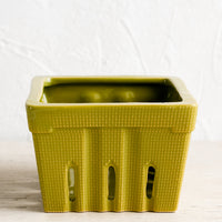 Moss Green: A ceramic berry basket in moss green.