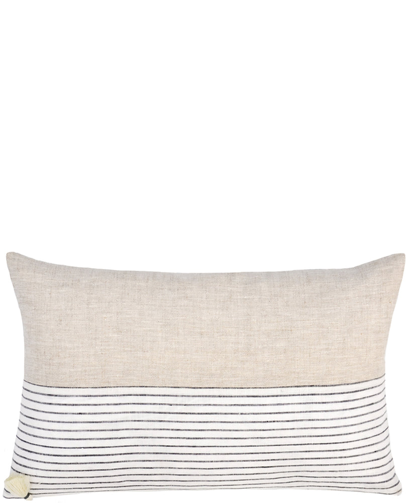 Rectangular throw pillow with natural linen top half and black and white striped bottom half