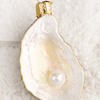 2: Holiday ornaments in the shape of a half oyster shell with pearl.