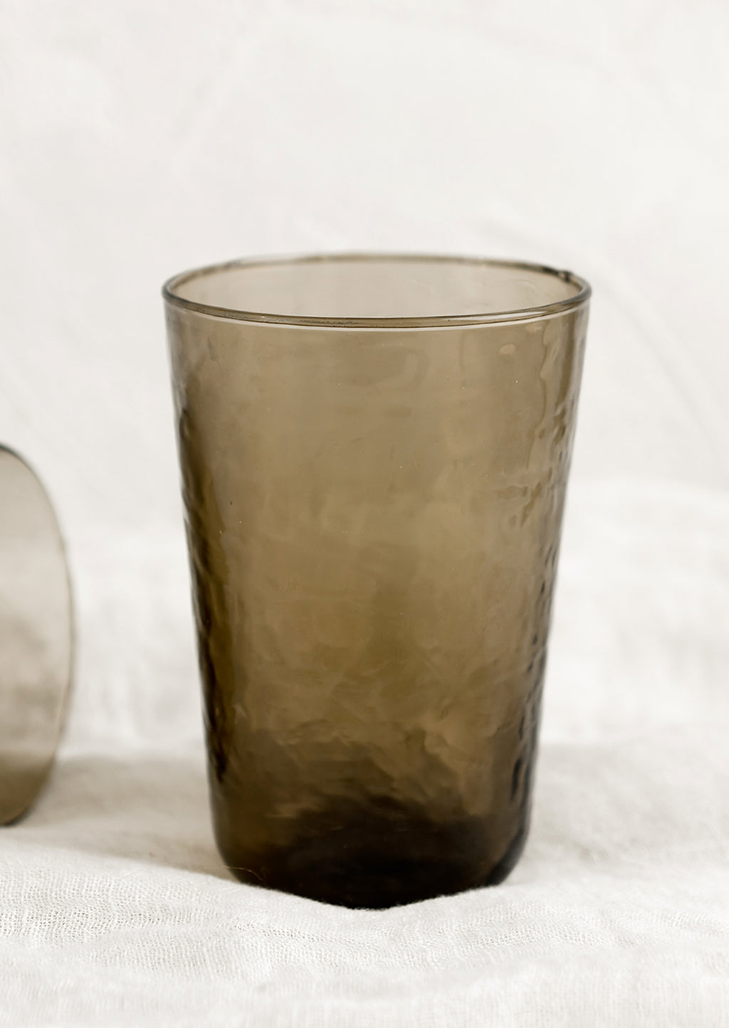 Truffle: A glass tumbler in hammered texture with brown tint.