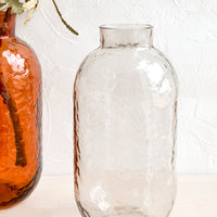 1: Tall glass vases with hammered texture.