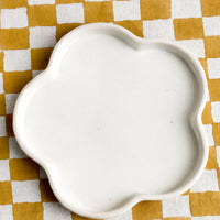 1: A white flower shaped ceramic plate.