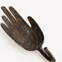 2: Wall hook in the shape of a hand with hook below, made in dark distressed metal