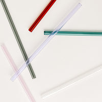 1: Scattered glass straws in assorted colors.