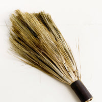 2: Primitive style handheld broom with cylindrical metal handle