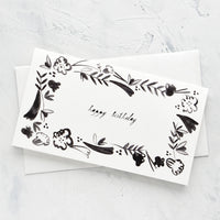 2: Black and white greeting card with floral frame around "happy birthday" script at middle