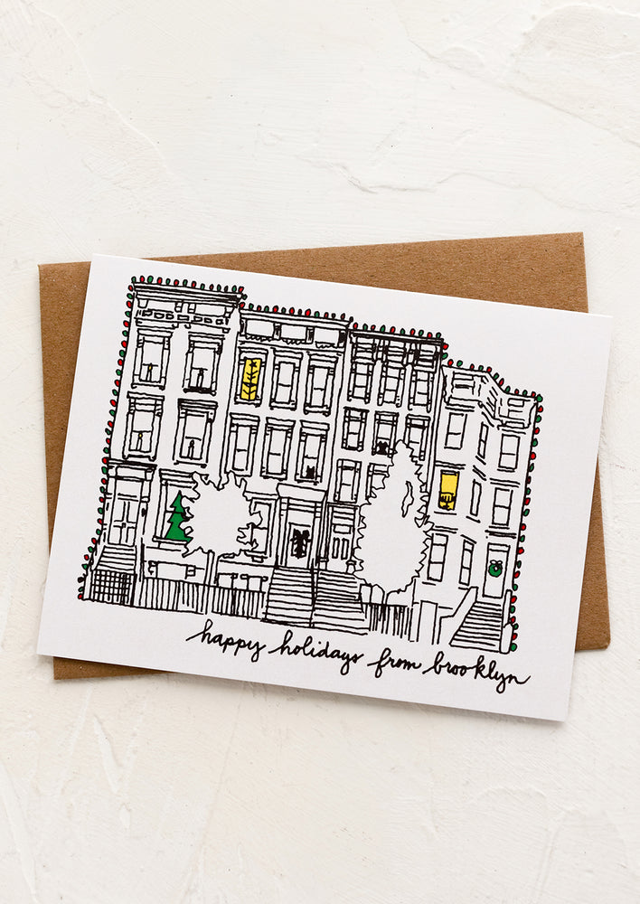 2: A card with drawing of brownstone and text reading "Happy holidays from Brooklyn".