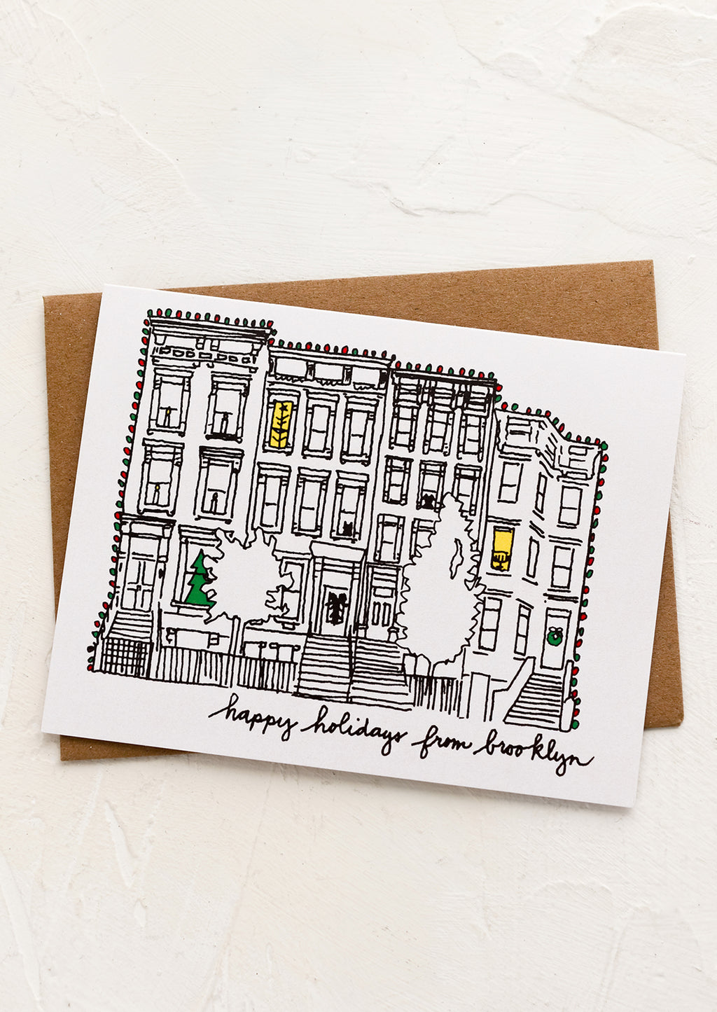 2: A card with drawing of brownstone and text reading "Happy holidays from Brooklyn".