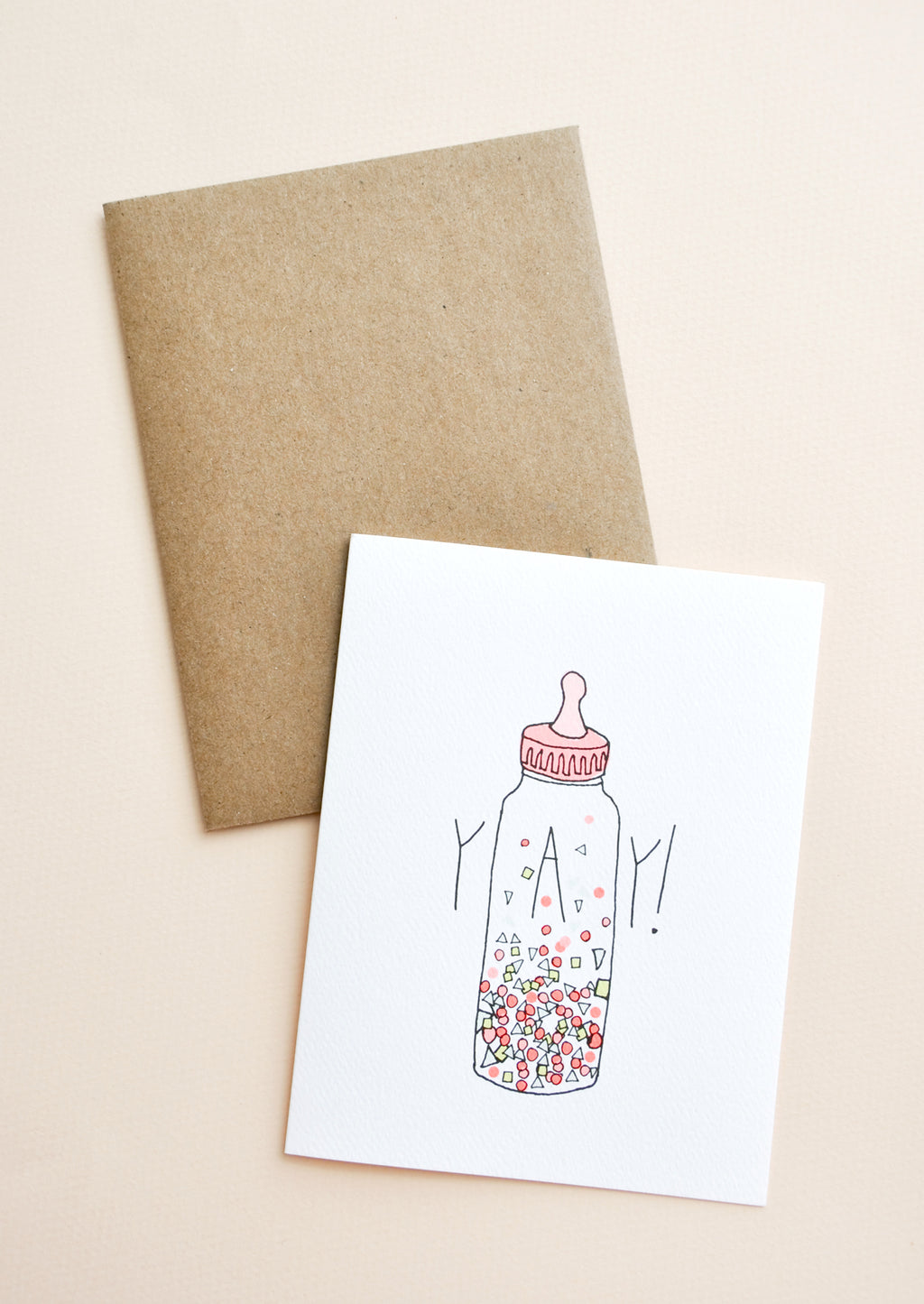 1: Greeting card with baby bottle filled with confetti and "YAY!" text