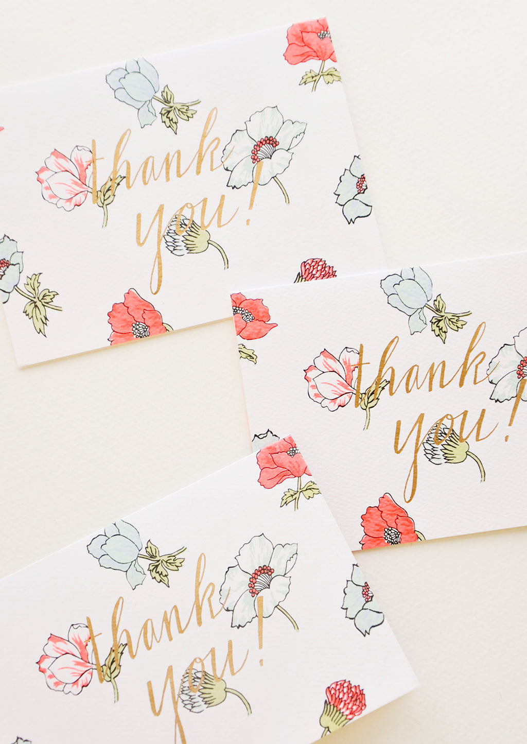 1: Set of notecards with neon flowers and the text "Thank you!" in gold foil.