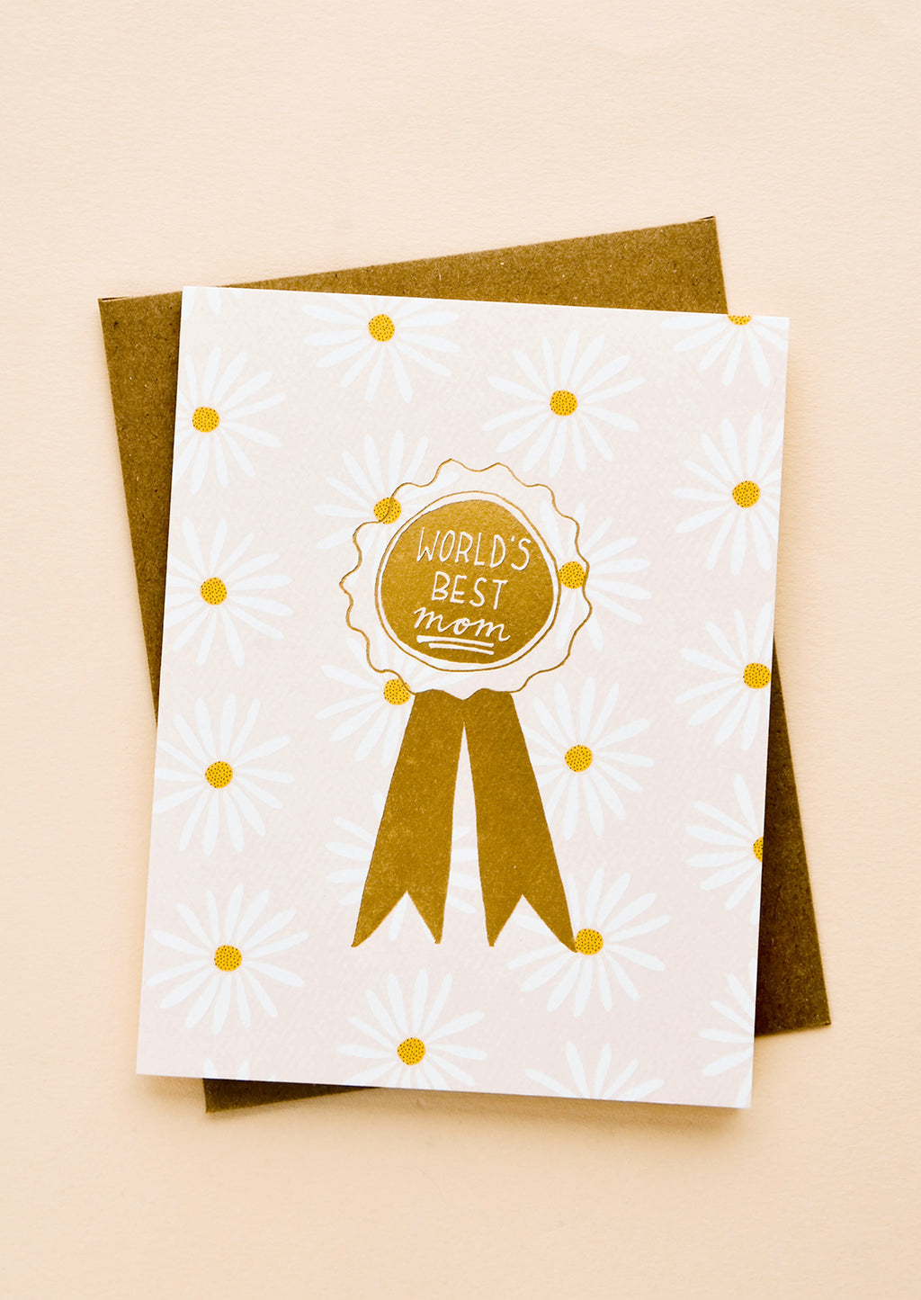 2: Greeting card with allover daisy pattern and gold ribbon reading "World's Best Mom" 