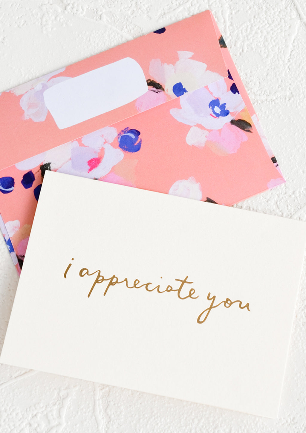 1: A white greeting card with golden cursive reading "I Appreciate You", paired with floral print envelope.