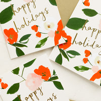 Boxed Set of 8: Red and green floral print greeting cards with "Happy holidays" in gold script.