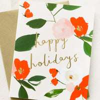 Single Card: A red and green floral print greeting card with "Happy holidays" in gold script.