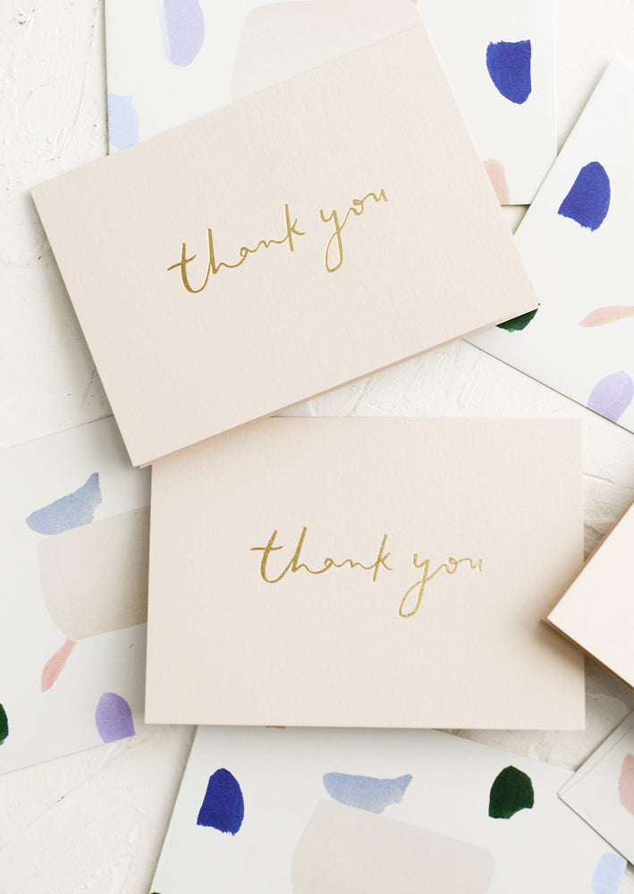 Thank you cards with patterned envelopes.