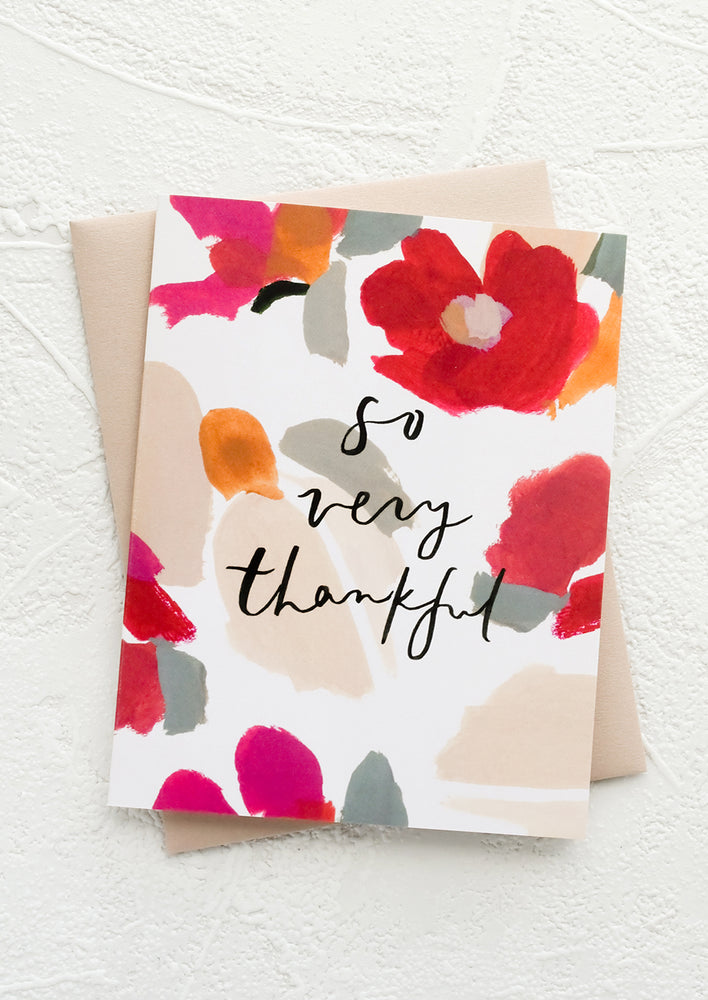 1: A floral print greeting card with black text reading "So very thankful".