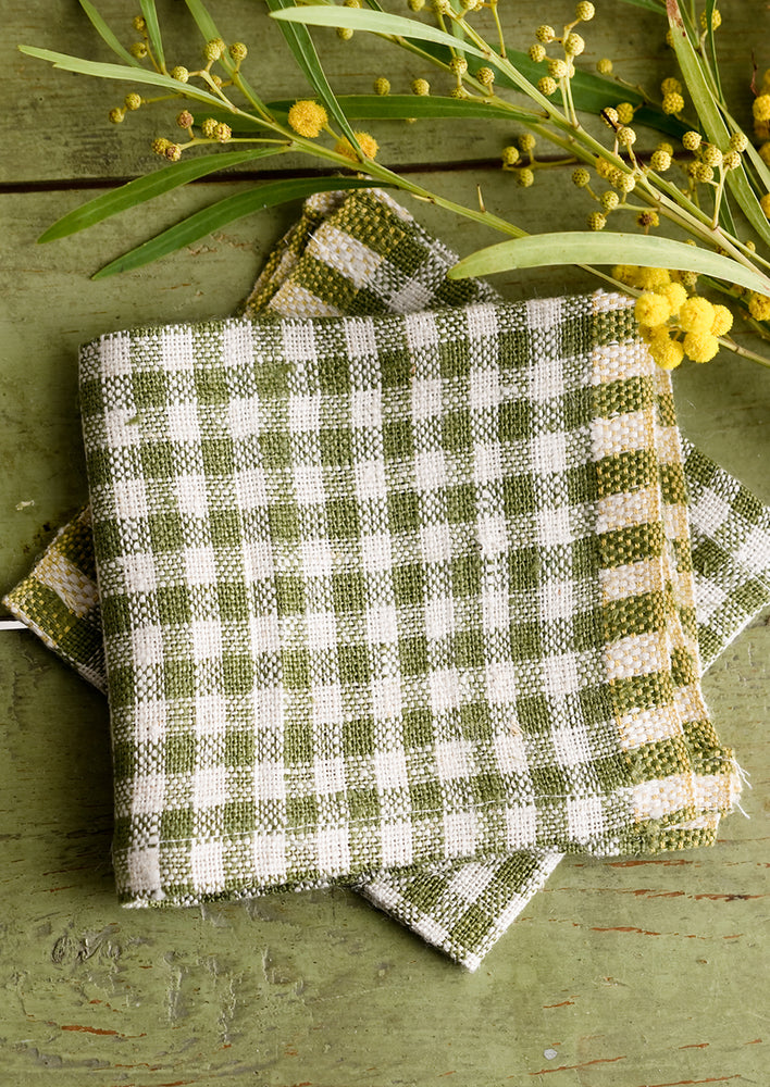 Olive Green: A pair of olive green gingham cocktail napkins.