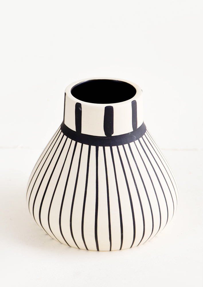 Ceramic vase in white with vertical black striping throughout
