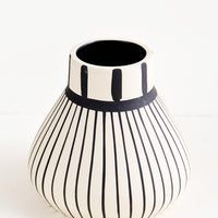 Thin Stripes: Ceramic vase in white with vertical black striping throughout