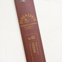 Cedar: A brown packaging sleeve containing cedar scented incense.