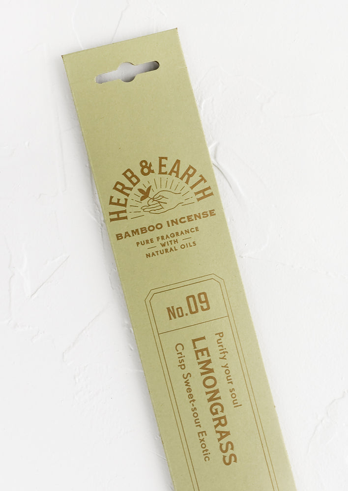 A mint green packaging sleeve containing lemongrass scented incense.