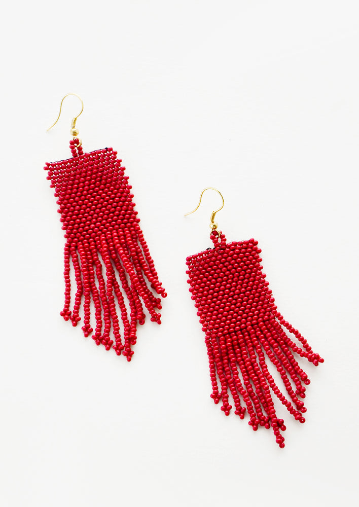 Red rectangular taper fringe beaded earrings.