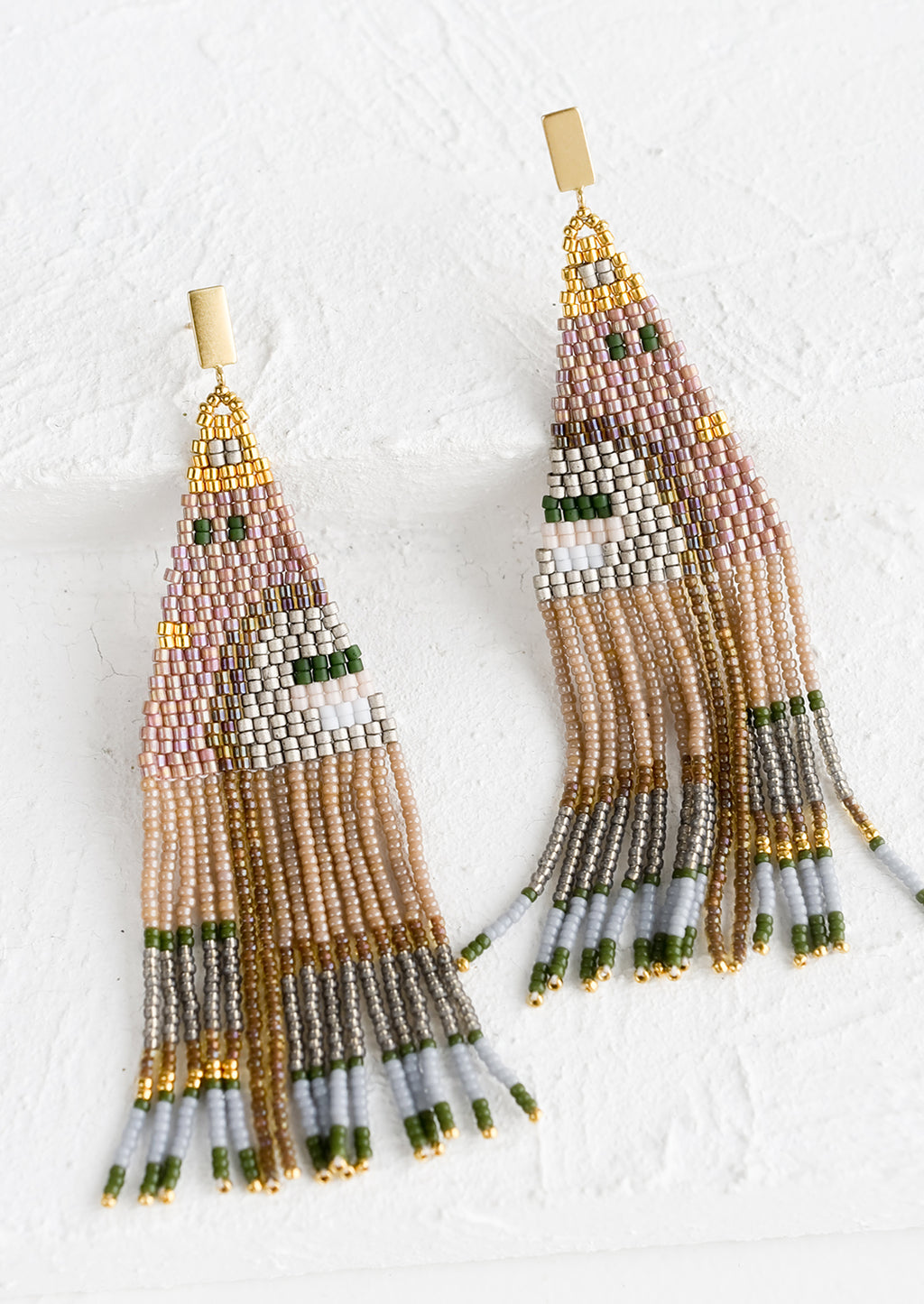 Latte Multi: A pair of beaded earrings in mauve and green geometric design with brass posts.