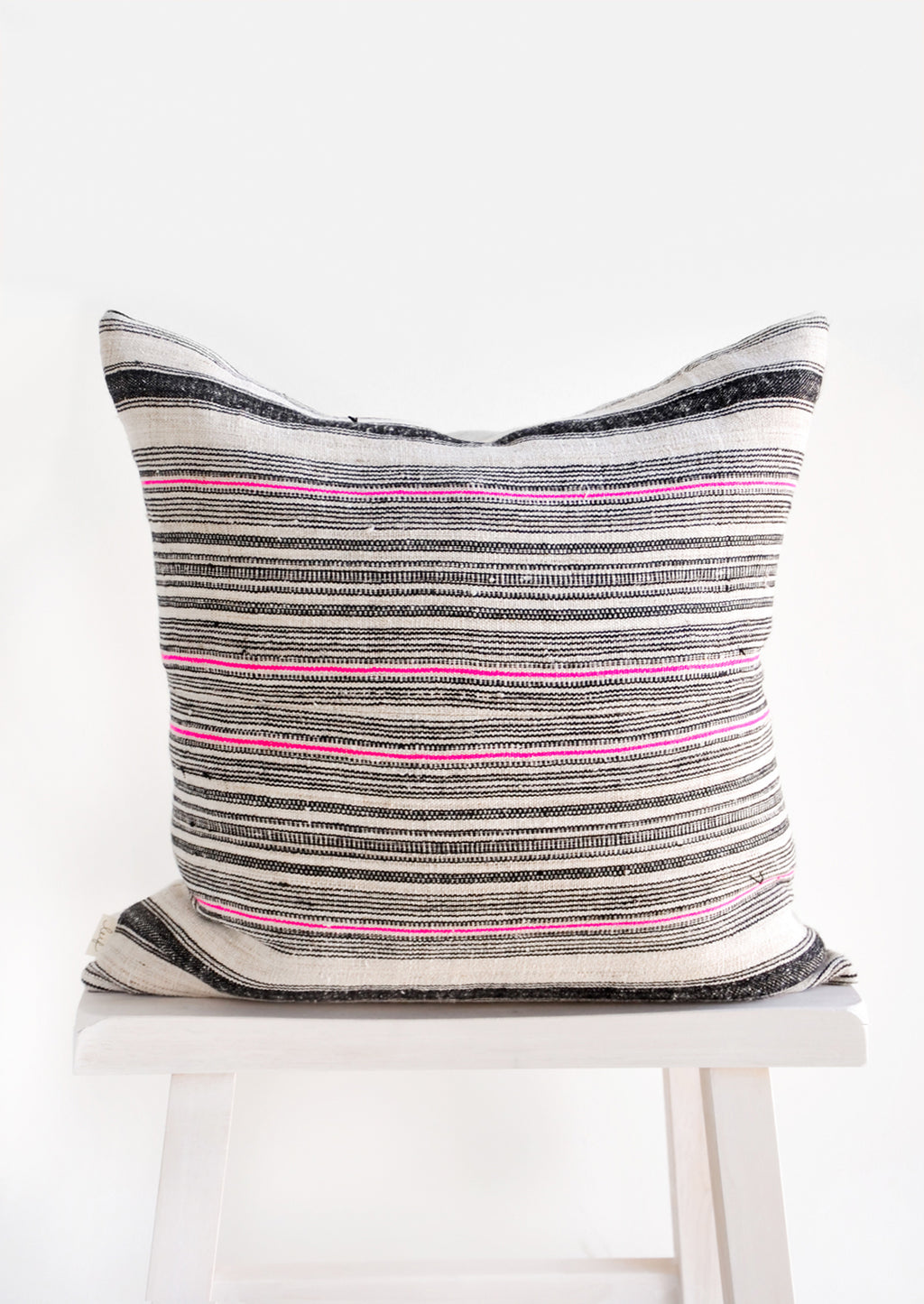 2: Square throw pillow in natural hemp fabric with varied stripes in black and hot pink