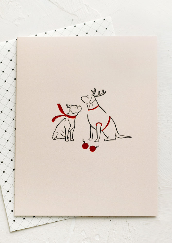 A card with illustration of two dogs wearing red scarves.