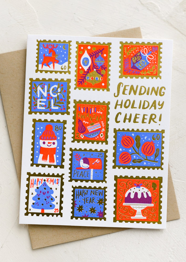 A card with illustrations of festive postage stamps, text reads "Sending Holiday Cheer!".
