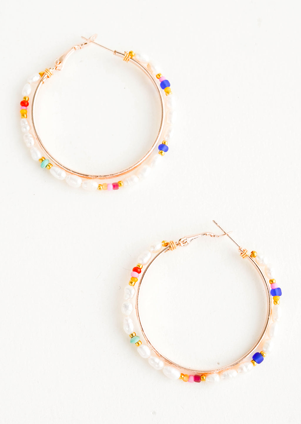 1: Round hoop earrings with beaded outer layer of pearls and colored glass seed beads and rosegold inner hoop