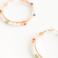 2: Round hoop earrings with beaded outer layer of pearls and colored glass seed beads and rosegold inner hoop