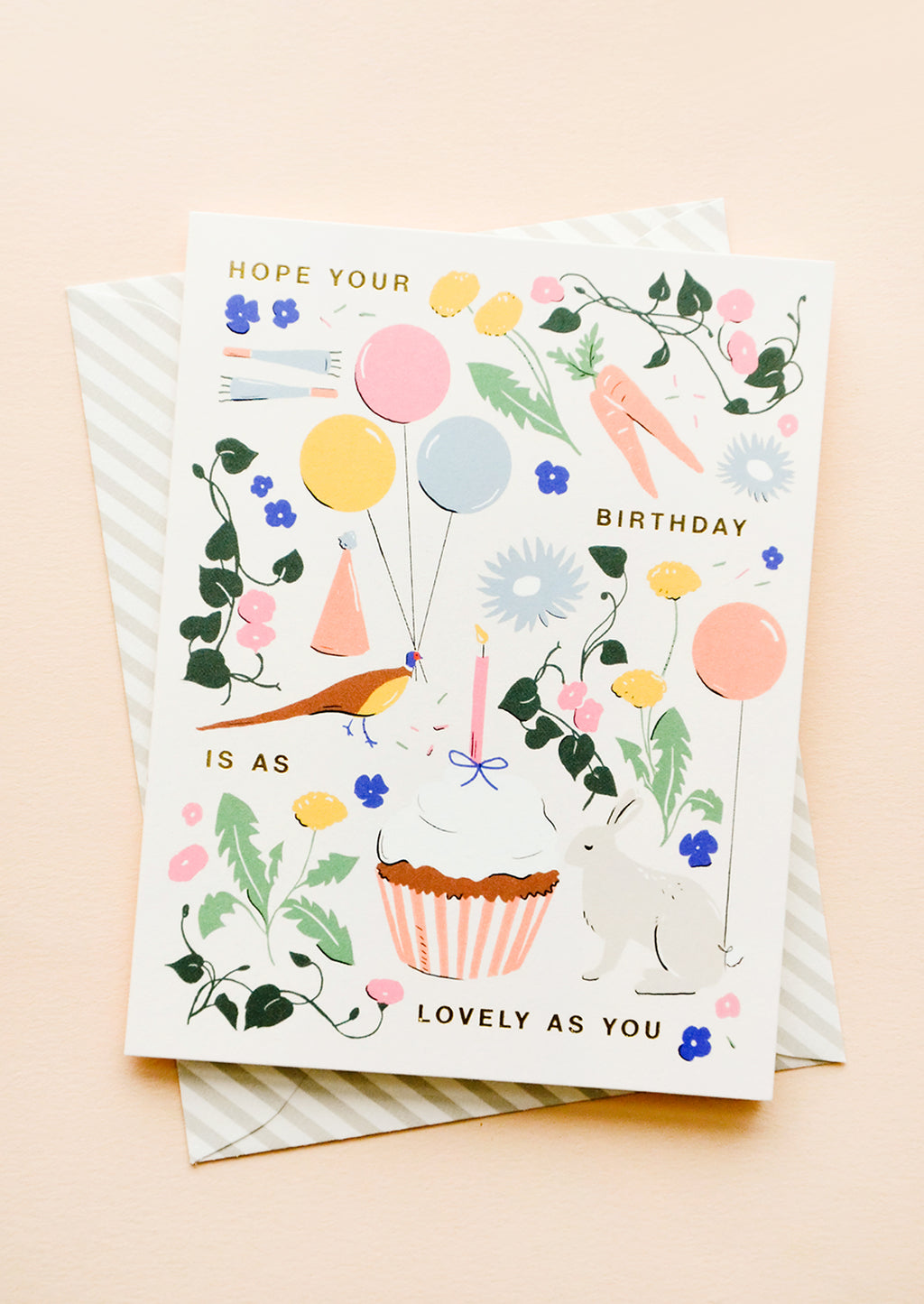 2: Whimsically illustrated greeting card with garden-centric scene and golden lettering reading "Hope your birthday is as lovely as you"