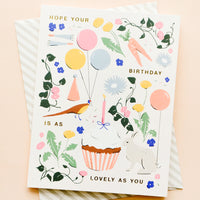 2: Whimsically illustrated greeting card with garden-centric scene and golden lettering reading "Hope your birthday is as lovely as you"