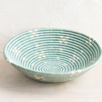 Lake Blue: A round sweetgrass bowl in blue with white pattern.