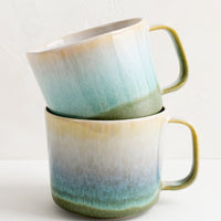5: Two stacked ceramic mugs.