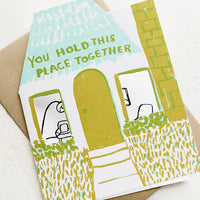 1: A house die cut shaped card reading "You hold this place together".
