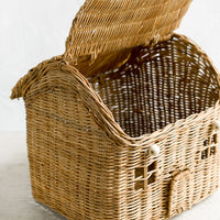 3: A rattan storage basket in the shape of a house.