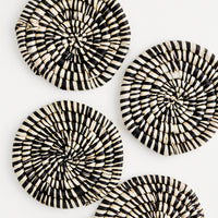 Black: Set of 4 Round Woven Raffia Coasters in Black and natural stripe.